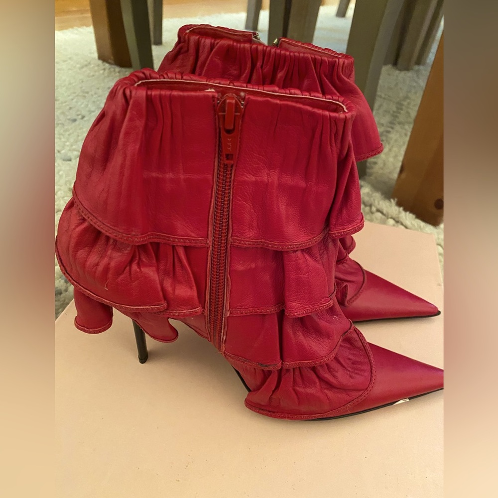 Beautiful leather designer booties. NEVER WORN.